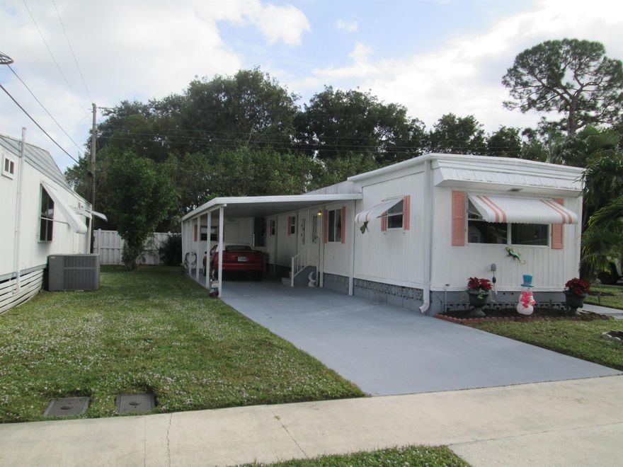 BEAUTIFUL 2 BEDROOM 2 FULL BATHROOM WITH A GREAT OPEN FLOOR PLAN. THIS HOME COMES FULLY FURNISHED  & YOU OWN THE LAND & HOA IS ONLY $120.00 A MONTH. SPLIT FLOOR PLAN WITH A LARGE OPEN LIVINGROOM THAT FLOWS RIGHT INTO THE  LARGE OPEN KITHEN,GREAT FOR ENTERTAINING. THE LIVINGROOMALSO A 2ND ENCLOSED PATIO 10 X 10 OUTSIDE YOU HAVE A LOCKED SHED THAT HAS A FULL SIZE WASHER/DRYER AND WORK AREA WITH PLENY OF SPACE FOR STORAGE. OUTSIDE IS NICELY LANDSCAPED WITH A LONG DRIVEWAY & COVERT PARIKNG. ALSO OUTSIDE THERE IS A NICE OPEN PATIO,GREAT FOR GRILLING OR JUST RELAX & ENJOY YOUR SLICE OF SOUTH FLORIDA.THIS COMMUNITY OFFERS A  A NICE CLUBHOUSE WITH A POOL,SHUFFLEBOARD,LIBRARY & PICNIC AREA.CLOSE TO GREAT DINING, & SHOPPING. JUST MINUTES FROM THE MALL &  I-95 & THE TURNPIKE.
