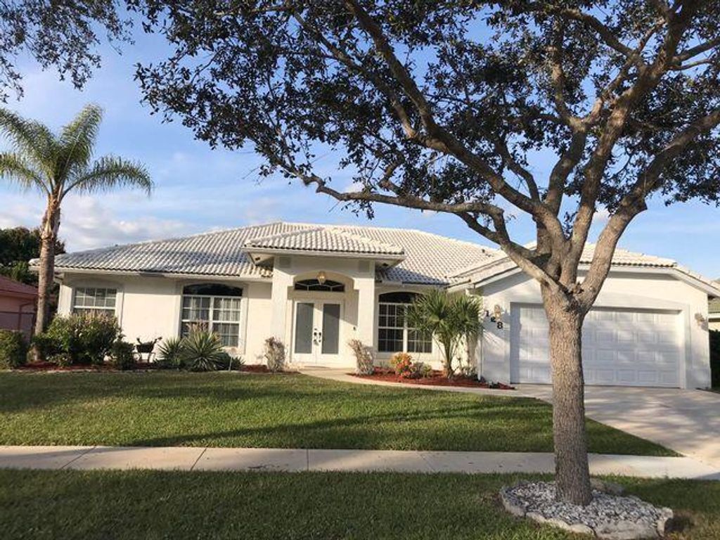 Photo of 128 Pepper Tree Crescent, Royal Palm Beach, FL 33411 (MLS # R11120271)