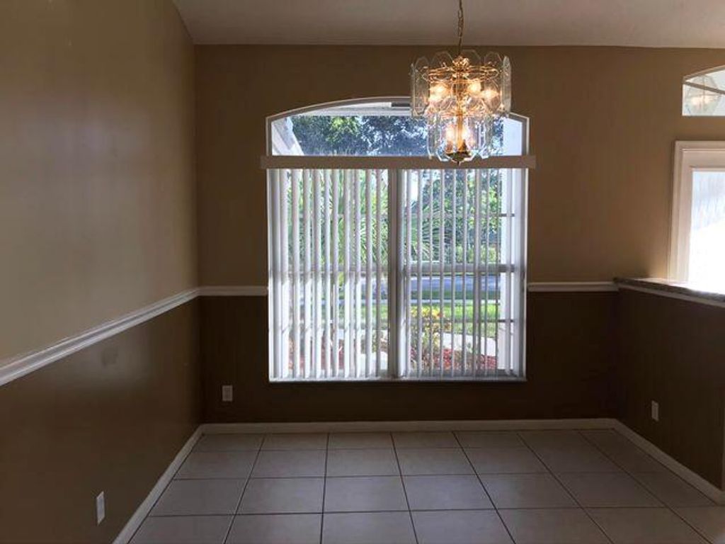 Photo of 128 Pepper Tree Crescent, Royal Palm Beach, FL 33411 (MLS # R11120271)