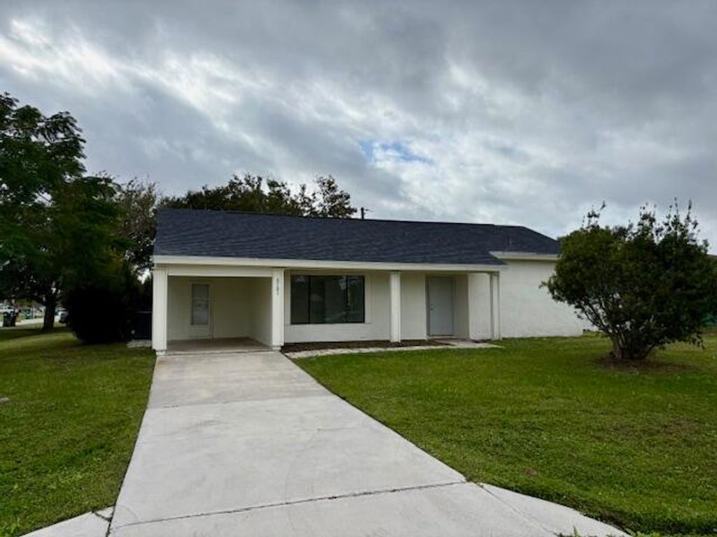 Photo of 2101 SE Holland Street, Port Saint Lucie, FL 34952 (MLS # B26010073)
