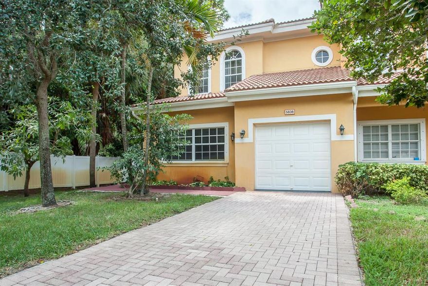 Gorgeous large trees surround this upscale, bright & airy, 3BR/2.5BA corner townhouse set-back on a quiet street in the highly convenient Greenacres community. Desirable features include extra high ceilings throughout, fully tiled first floor laid on the diagonal, and dark wood flooring throughout the second floor. A gourmet kitchen with stainless steel appliances is adjacent to a brick floor patio that is perfect for grilling. The backyard offers plenty of privacy and is surrounded by meticulously kept lush tropical landscaping. You'll enjoy the oversized master suite with large windows, a spacious walk-in closet and a huge en-suite bath. This premium townhouse also offers a family room just off the kitchen, a half bath for guests, and a garage.