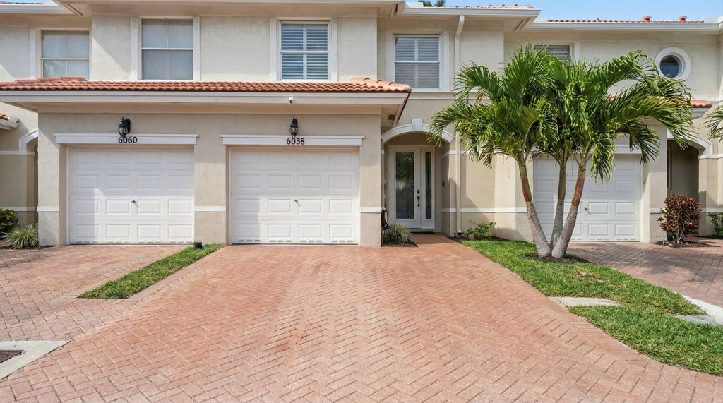Photo of 6058 Seminole Gardens Circle, Riviera Beach, FL 33418 (MLS # R11159982)
