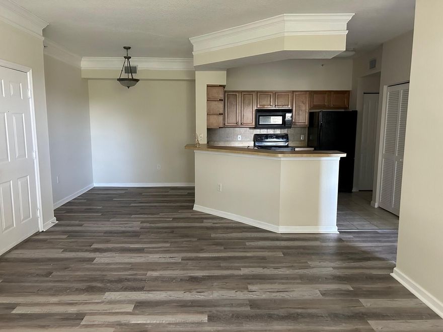 Spacious 1/1 on second floor with balcony. Lovely view. Great location. Well maintained Gated community. Nice amenities. Brand new flooring and paint. Ceiling fans in every room, Crown Molding, Full size Washer/Dryer in the unit, Walk in closet. Great Balcony with serene view. New A/C and Water heater WATER INCLUDED Small Pets are welcome with restrictions and fee. No aggressive breeds. Employment and rental history verification are required. Income Restrictions apply - Must show income of $5500 or greater. 2 months security, no last month required. 1 assigned parking spot