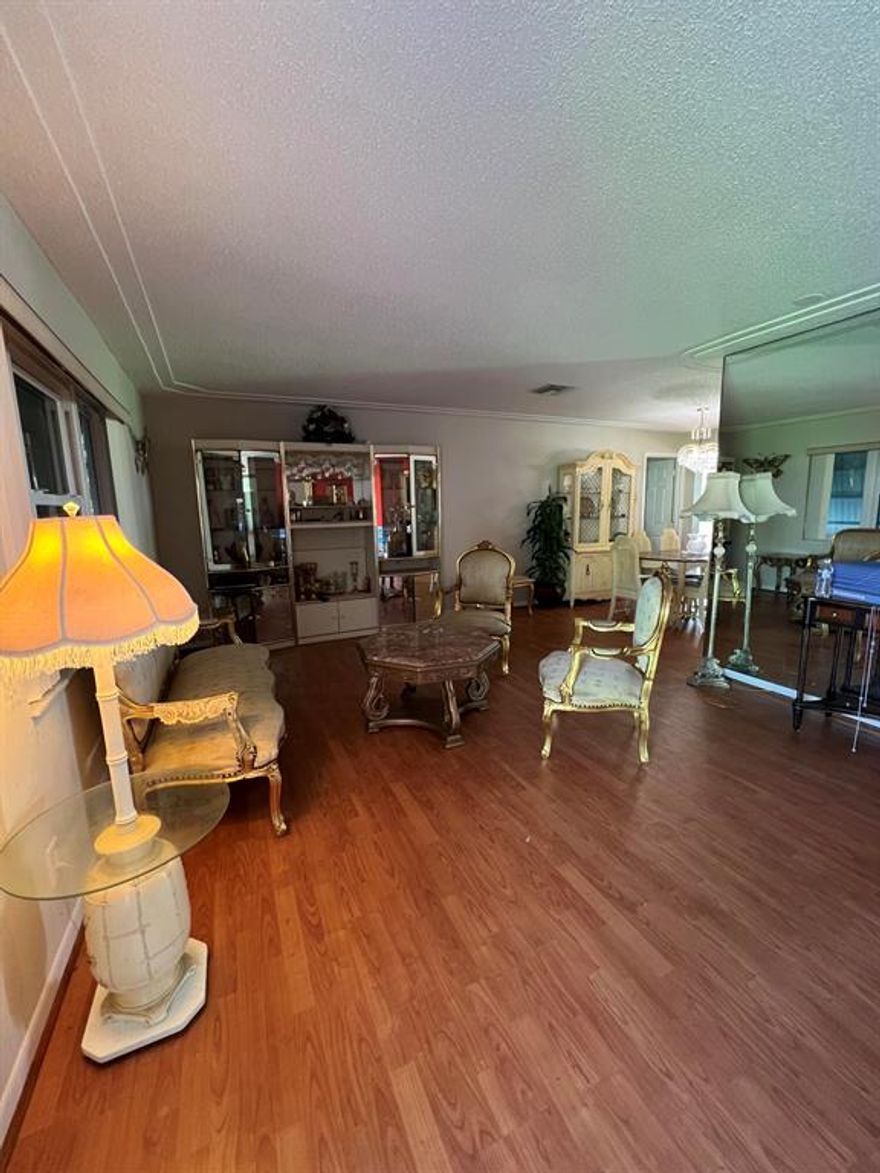 2/2 Challenger model, EASY FIXER-UPPER! Can rent right away, 3 mth min, 3 times per year! Spacious floor plan with florida room. Walk to clubhouse 2 and 3. 18 HOLE GOLF COURSE, 3 CLUBHOUSES, 3 HEATED POOLS. Paid Rec Lease, 55 plus community!