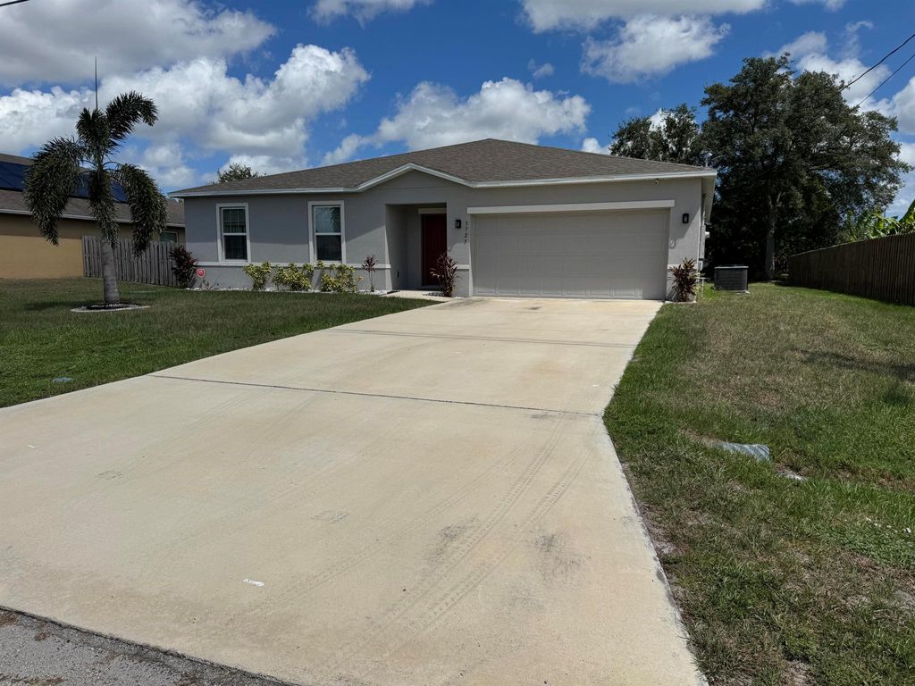 Photo of 3725 SW Kasin Street, Port Saint Lucie, FL 34953 (MLS # R11128138)