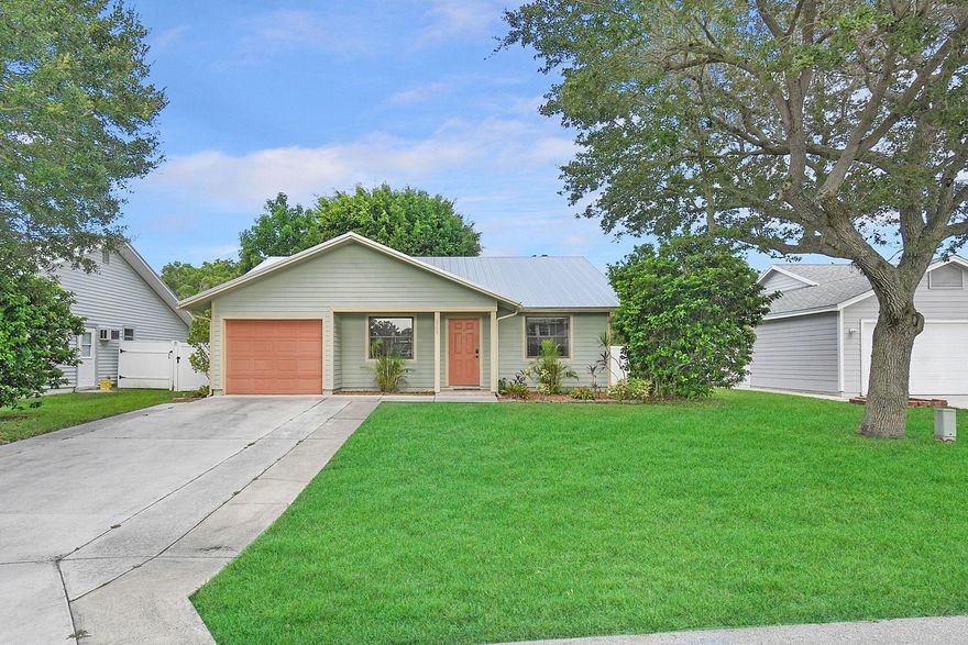 Discover a hidden gem nestled in a quiet neighborhood, where potential meets charm! This home offers two well-defined bedrooms, plus a versatile third room that's brimming with possibilities—think home office, cozy den, or even a guest retreat with direct access to a serene, screened patio. The Spanish tile floors throughout lend a warm, inviting touch, while the kitchen's reliable appliances are ready for your culinary adventures. But the real surprise? A second-story loft above the garage, bathed in natural light from skylights and cooled by its own window AC, making it the perfect creative space. With a generator that can help power necessary items and this unique loft, you're all set for whatever life throws your way. This home is waiting for someone to unlock its full potential!