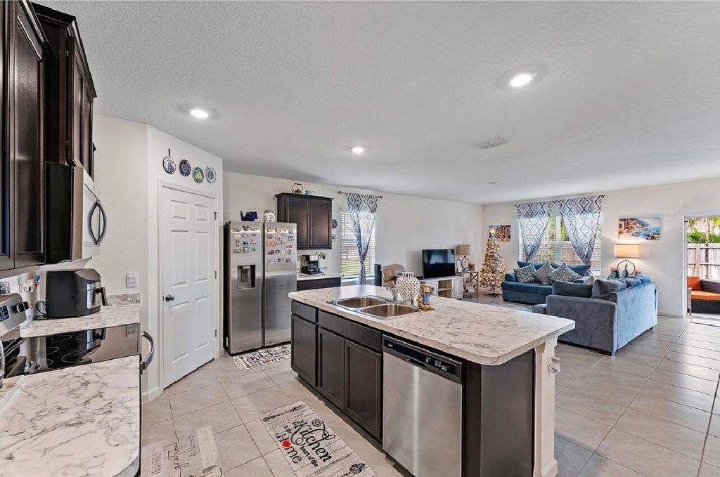 Photo of 1771 SW Lofgren Avenue, Port Saint Lucie, FL 34953 (MLS # B26020436)