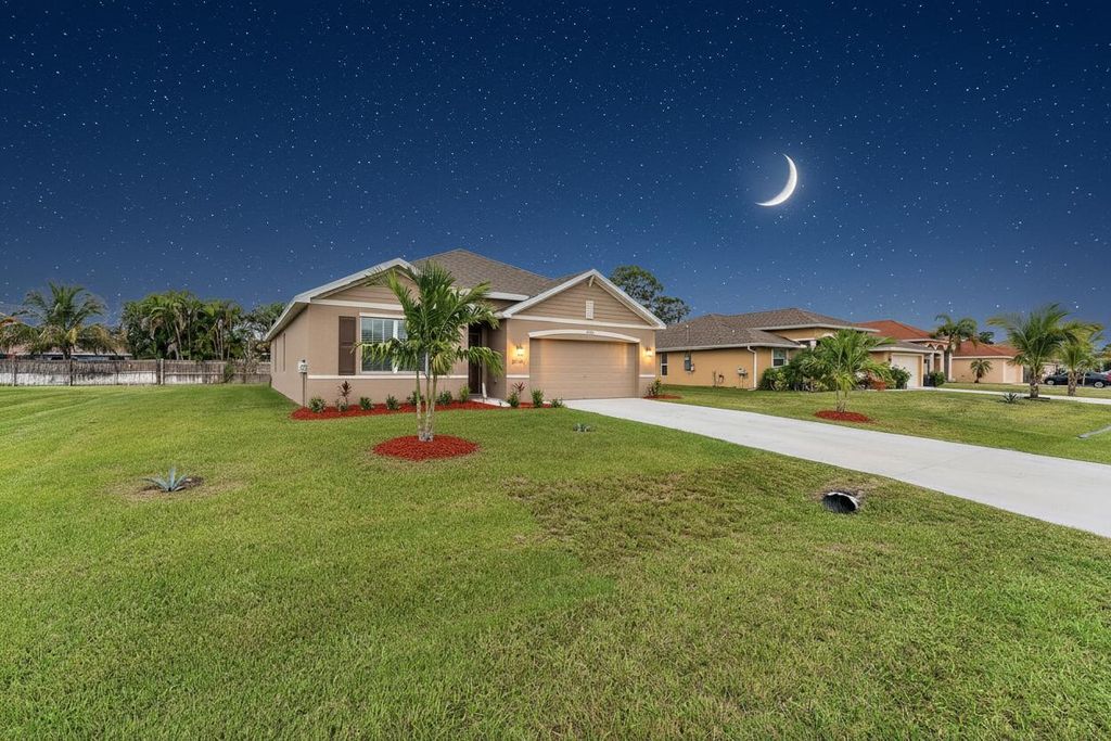 Photo of 1771 SW Lofgren Avenue, Port Saint Lucie, FL 34953 (MLS # B26020436)