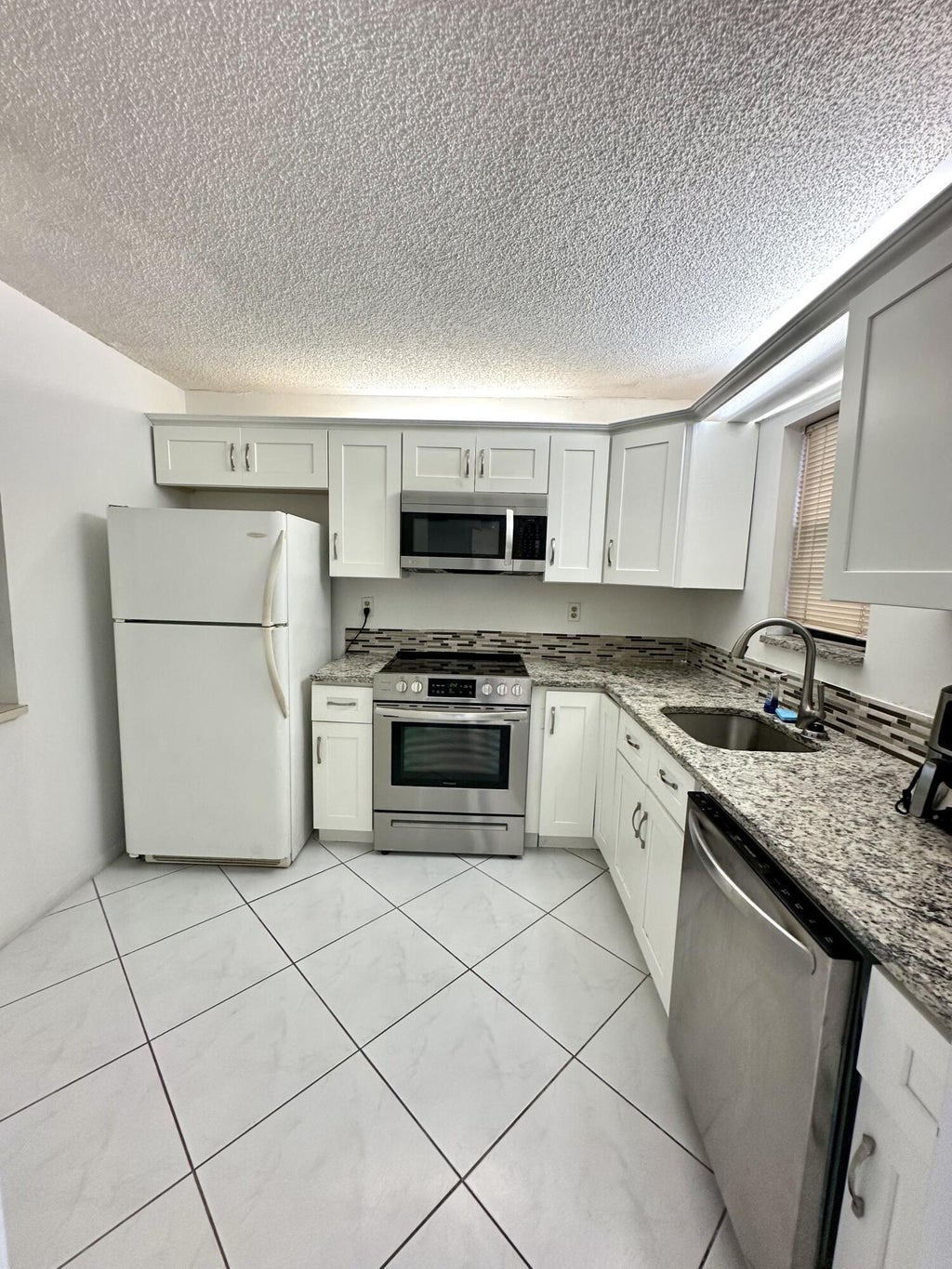 Photo of 9370 SW 8th Street, Boca Raton, FL 33428 (MLS # B26075809)