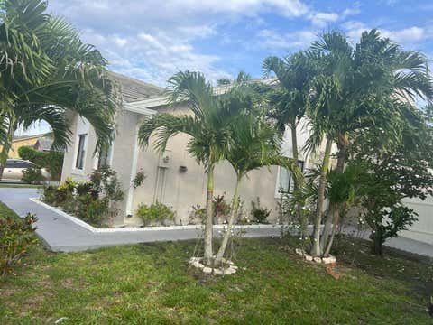 Photo of 5765 Strawberry Lakes Circle, Lake Worth, FL 33463 (MLS # B26036092)