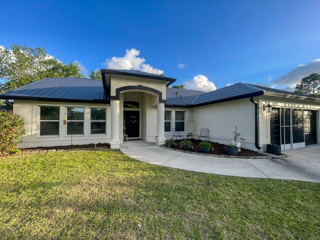 Photo of 5766 NW Jigsaw Lane, Port Saint Lucie, FL 34986 (MLS # B26010031)