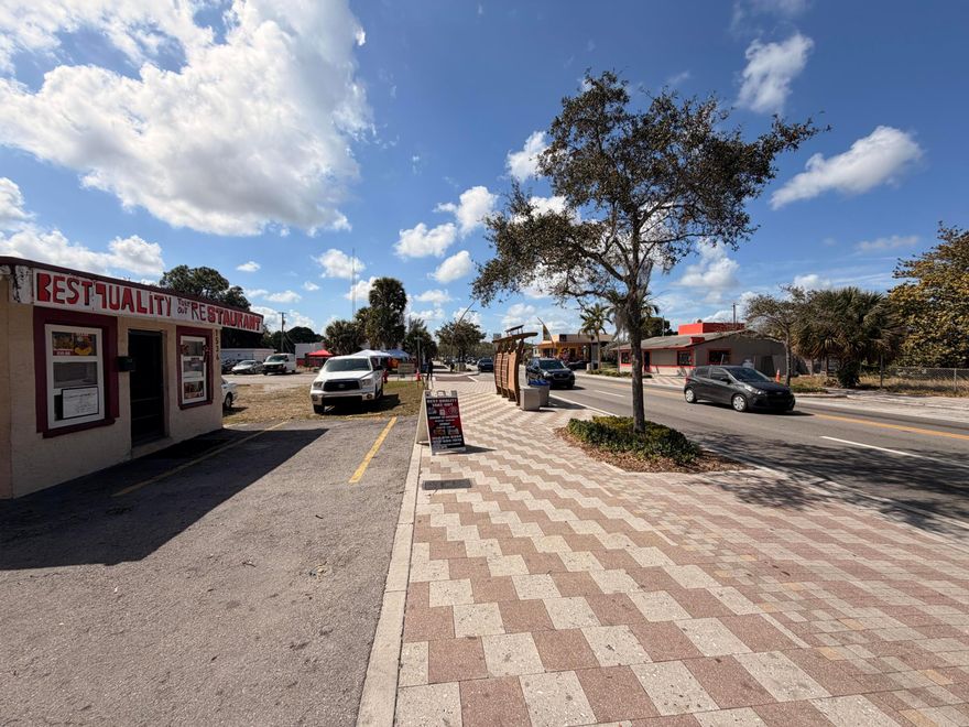 SMALL HOTEL ROOM WITH ADJACENT SHARED BATHROOM