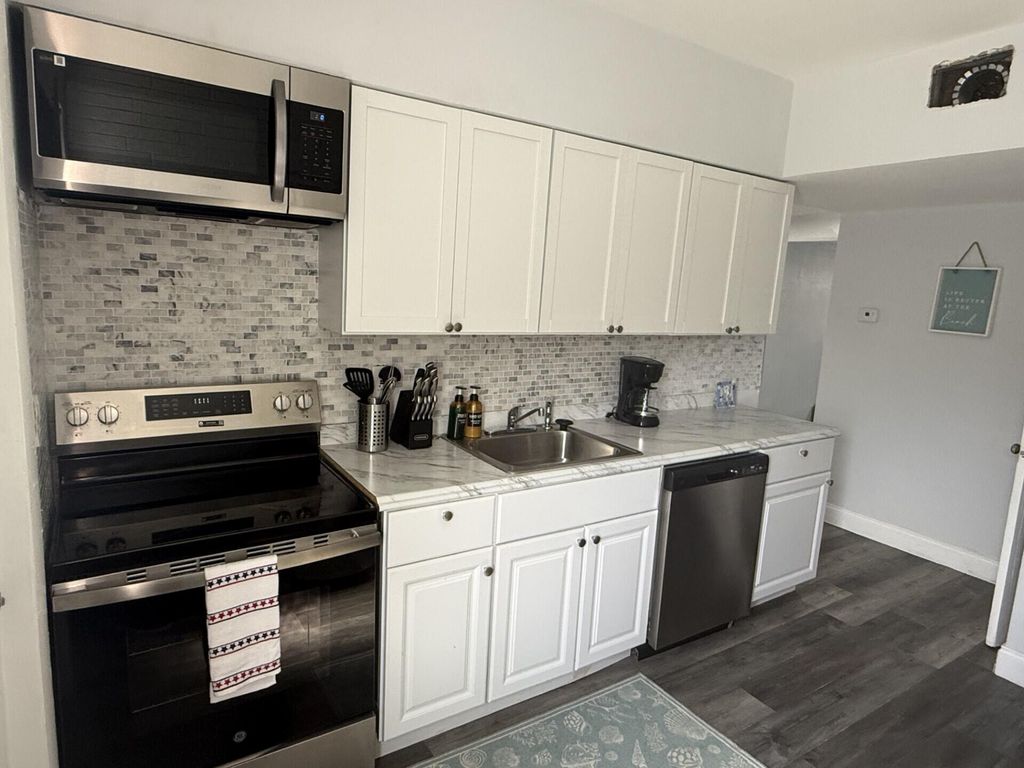 Photo of 131 E 27th Street #6, Riviera Beach, FL 33404 (MLS # B26014534)