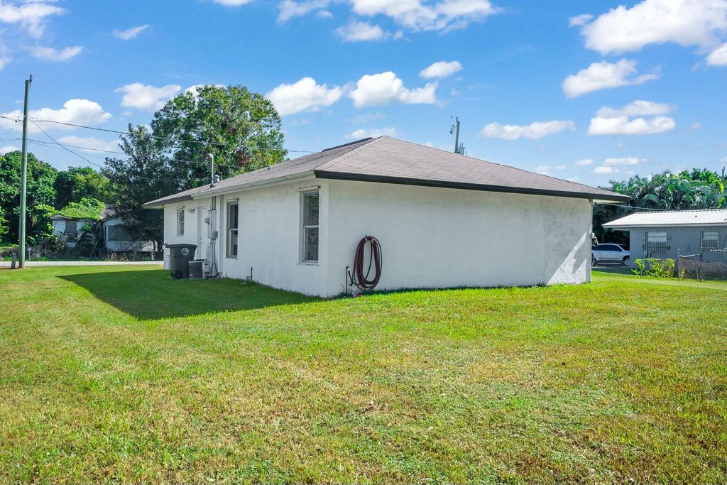 Photo of 116 SE 3rd Street N, Belle Glade, FL 33430 (MLS # R11041811)