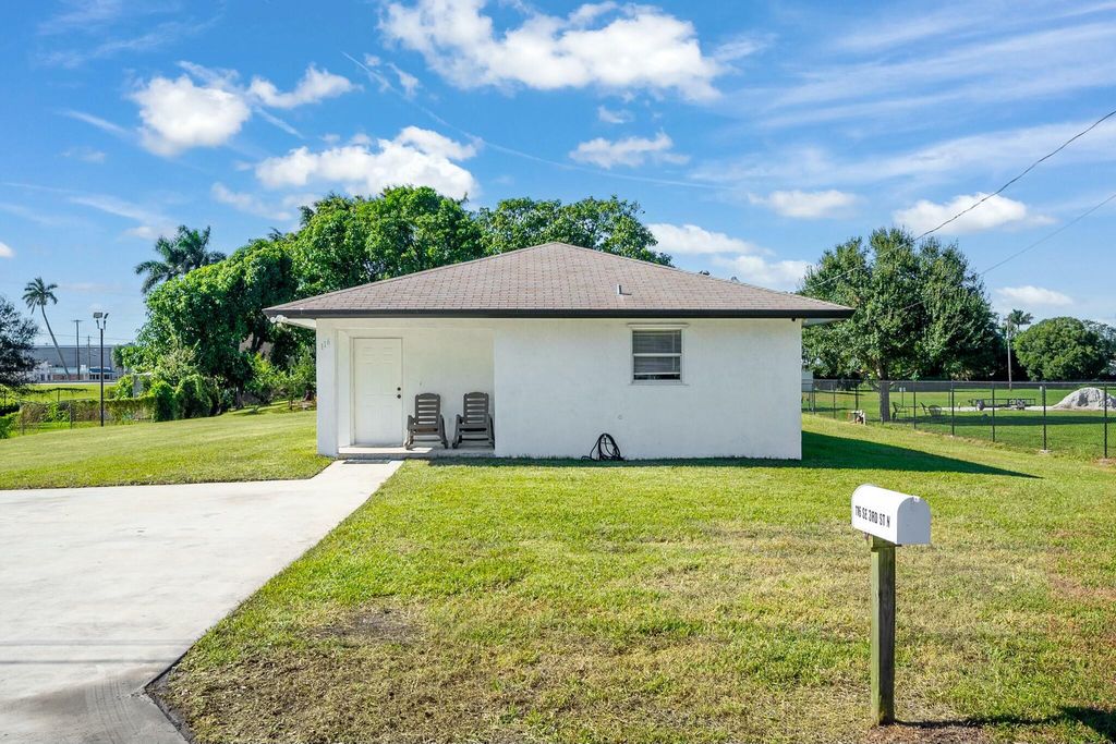 Photo of 116 SE 3rd Street N, Belle Glade, FL 33430 (MLS # R11041811)