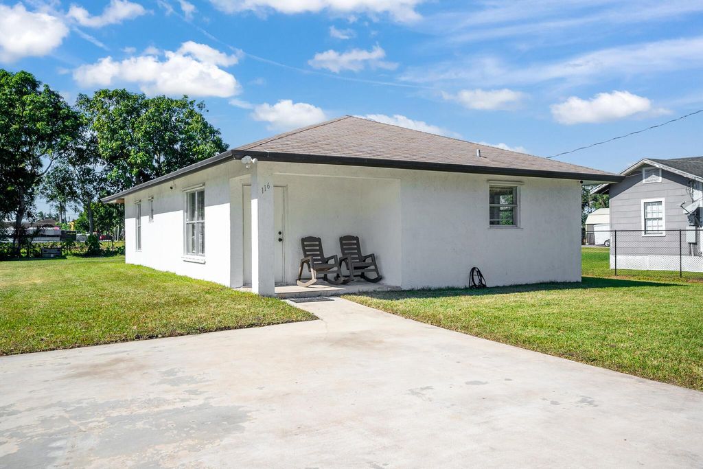 Photo of 116 SE 3rd Street N, Belle Glade, FL 33430 (MLS # R11041811)