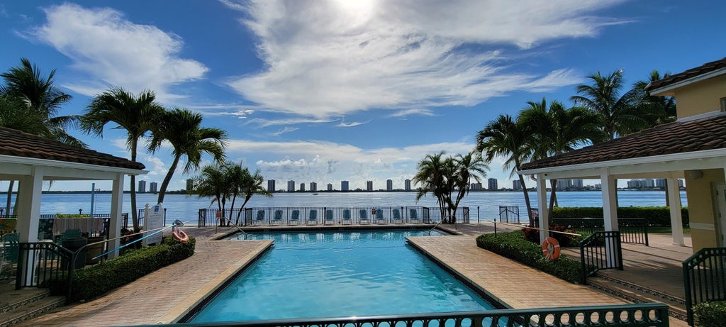 Photo of 1125 Lake Shore Drive #202, Lake Park, FL 33403 (MLS # B26011795)