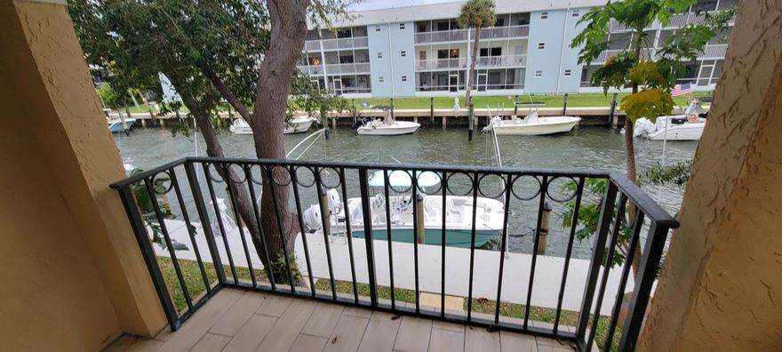 Updated Waterfront 2B 2B Condo in Lake Park's Bay Reach Community. Enjoy your private balcony overlooking the water and watch the boats go by! Updated kitchen with tile floors throughout. Enjoy your privacy with the primary bedroom on the second floor and the guest bedroom and bath on the first floor. Open great room is perfect for entertaining and enjoying the Florida lifestyle. Conveniently located near shops and restaurants.