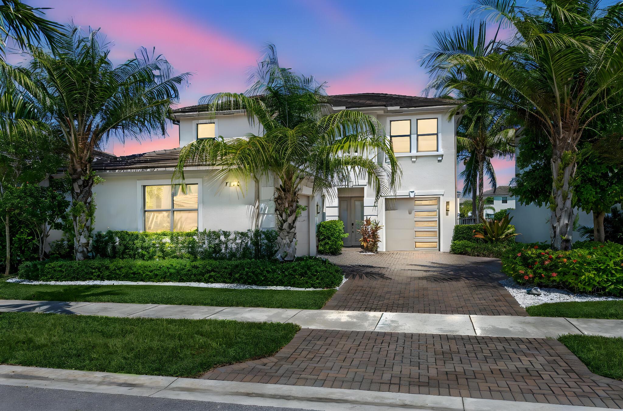 Luxury Lakefront Living in Toscana Isle!Welcome to 7178 Montereal Path -- a show-stopping, designer model home located in the highly sought-after gated community of Toscana Isles in Lake Worth Beach. This 4-bedroom, 2.5-bathroom residence effortlessly blends modern elegance with resort-style comfort, offering the ultimate South Florida lifestyle.Step inside to discover an open-concept floorplan adorned with wide-plank wood flooring, custom designer lighting, and sleek architectural accents throughout. The chef's kitchen is a true centerpiece, featuring an oversized quartz island, designer cabinetry, wall mounted oven, and a gas cooktop -- perfect for entertaining and everyday luxury.