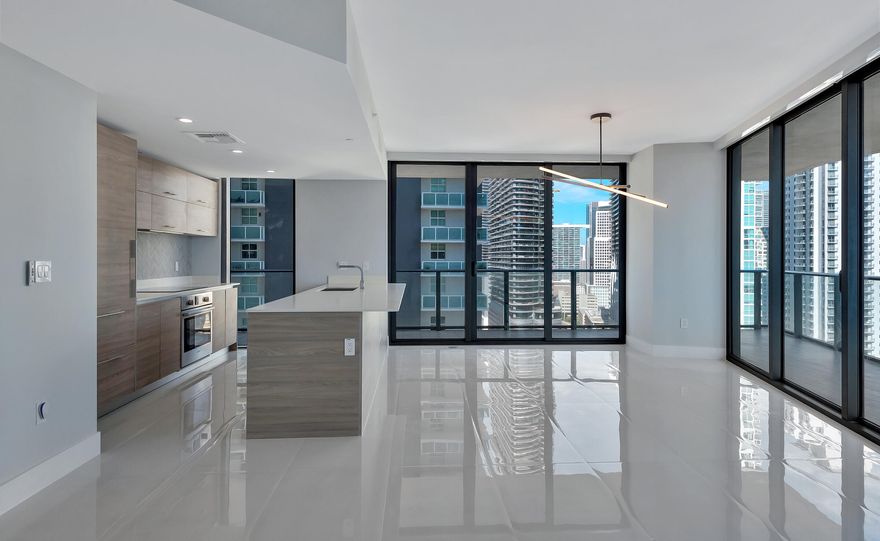 Desirable corner 2-bedroom + den on the 24th floor of SLS Brickell with abundant natural light and stunning skyline and water views throughout the expansive floor-to-ceiling windows. Flexible den ideal for office or guest space. Modern finishes include a contemporary kitchen with Sub-Zero appliances, sleek cabinetry, and well-appointed baths. Open layout perfect for living and entertaining. Residents enjoy resort-style, hotel amenities including rooftop and heated pools with private cabanas, full-service spa, state-of-the-art fitness center, concierge, valet, 24-hour security, restaurant Bazaar Mar by Jose Andres, Fi'lia by Michael Schwartz-bar/lounge and club rooms, business center, and one assigned parking space. Located in the heart of Brickell, steps to Brickell City Centre.