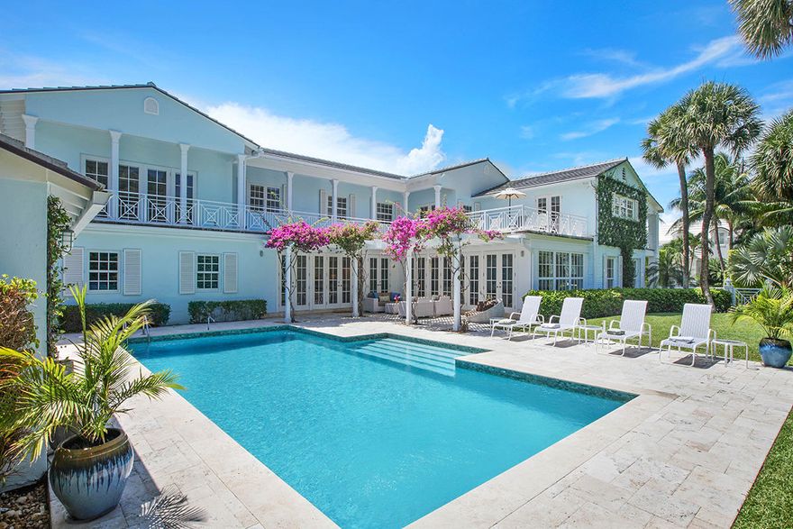 Palm Beach Paradise. This recently renovated classic Palm Beach Island masterpiece will astound you. The sophisticated and open floorplan provides a bright and tranquil setting just steps from your deeded beach access and close to the best of Palm Beach shopping and dining. The contemporary design features beamed ceilings and living spaces that flow gracefully unto each other. A major renovation added additional space and modern high tech conveniences such as a brand new elevator, a/c units, a new roof and impact GCI windows and doors. Travertine marble floors lead gracefully throughout the main floor. The heart of the home, the large family room, overlooks the pergola covered patio and the 20'x40' pool.