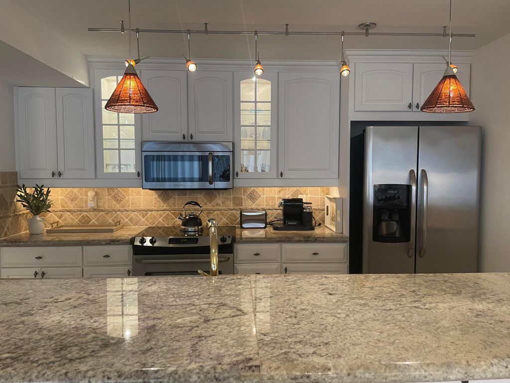 Photo of 301 Old Meadow Way, Palm Beach Gardens, FL 33418 (MLS # R10962642)