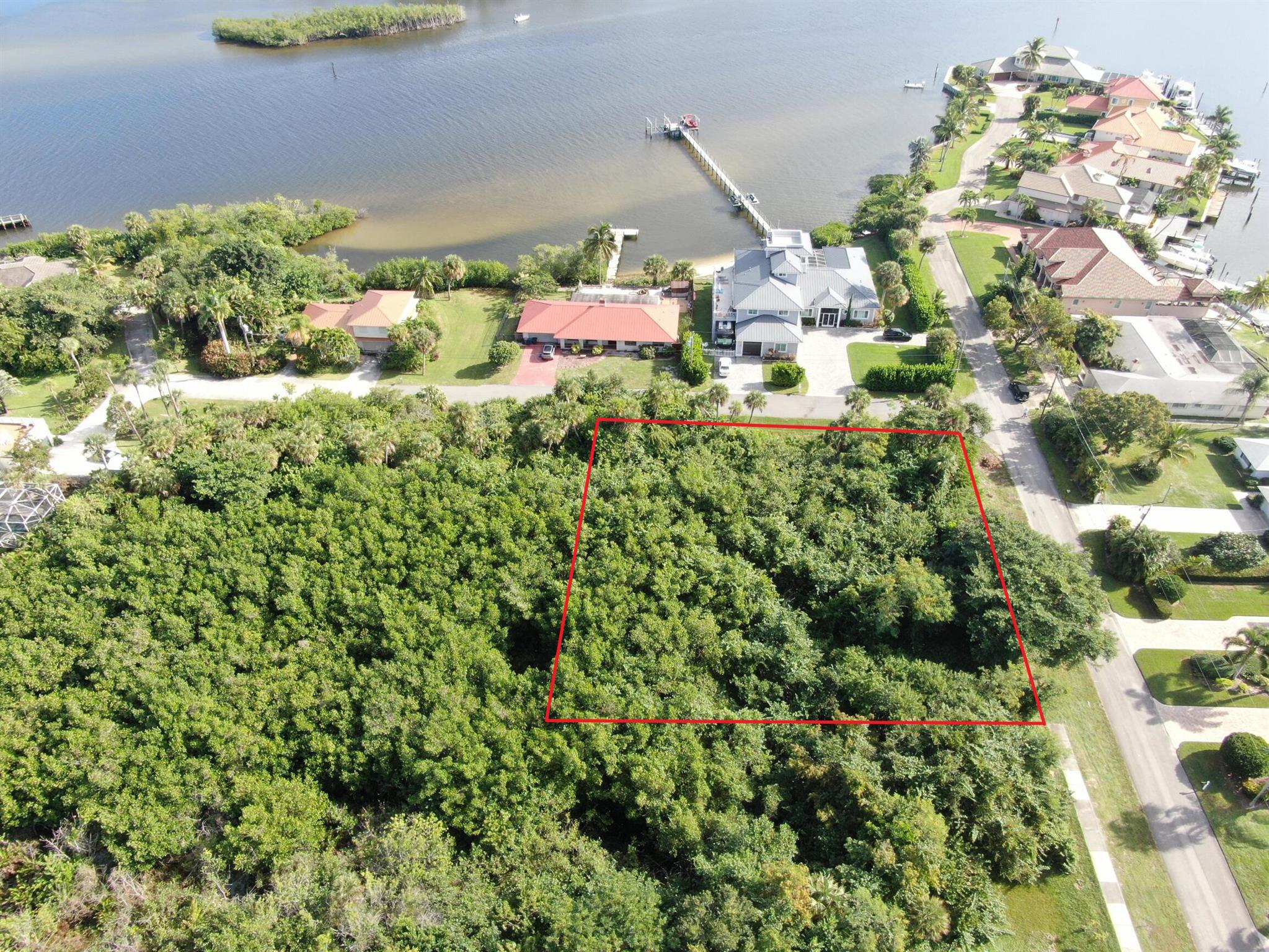 Panoramic water views await! Build your custom two or three story dream home on this beautiful 0.61 acre corner lot in the highly desirable neighborhood of Rocky Point. Situated across the street from the intracoastal on a very quiet and peaceful dead-end street with almost zero traffic, you'll be minutes away from public boat ramps, shopping, I-95, and some of the best schools in Florida! You can use the approved existing approximately 4,300 sq ft building pad or work with your builder to fill and expand. Bldg. app. requires a wetland waiver. Wetland determination completed and available for serious buyers. There is No HOA. Don't miss the opportunity to own one of the last buildable lots with water views in Rocky Point!