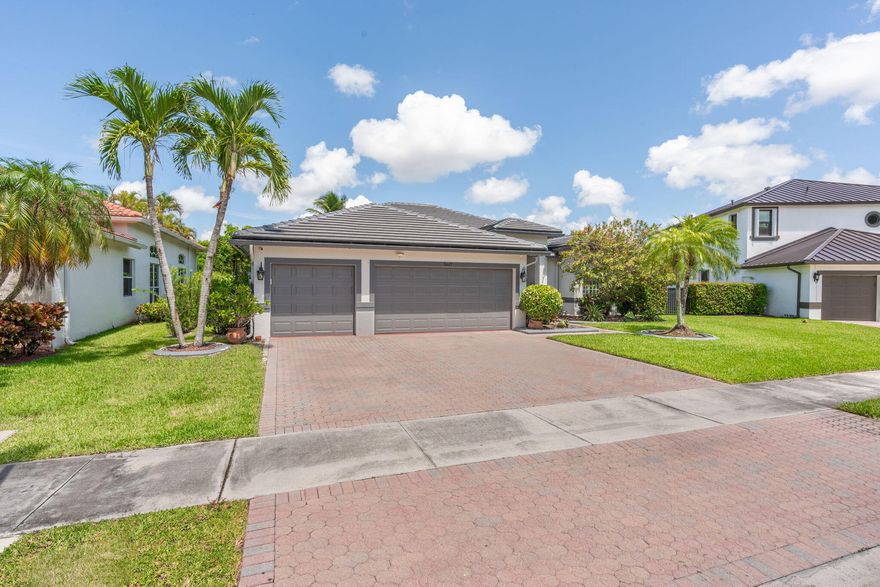 Sellers have spared no expense in this fully updated 5 bedroom, 3 bathroom pool home with tranquil water views located in the highly sought after community of Vanderbilt Estates. From the moment you walk in, you'll notice the attention to detail with new flooring throughout, designer finishes, abundant natural light, and a spacious open layout perfect for entertaining. The stunning chef's kitchen features premium appliances, custom cabinetry, double ovens, and oversized island seating overlooking the expansive family room. The luxurious bathrooms have been beautifully renovated with modern finishes and spa like touches. The home also features a custom indoor and outdoor sound system, creating the perfect atmosphere for entertaining both inside and out.  Step outside to your private backyard oasis complete with an incredible resort style pool area, covered patio, lush landscaping, and peaceful water views. Additional upgrades include a brand new roof and more. Located on a quiet cul de sac near top rated schools, shopping, dining, parks, and easy access to Sawgrass Expressway.