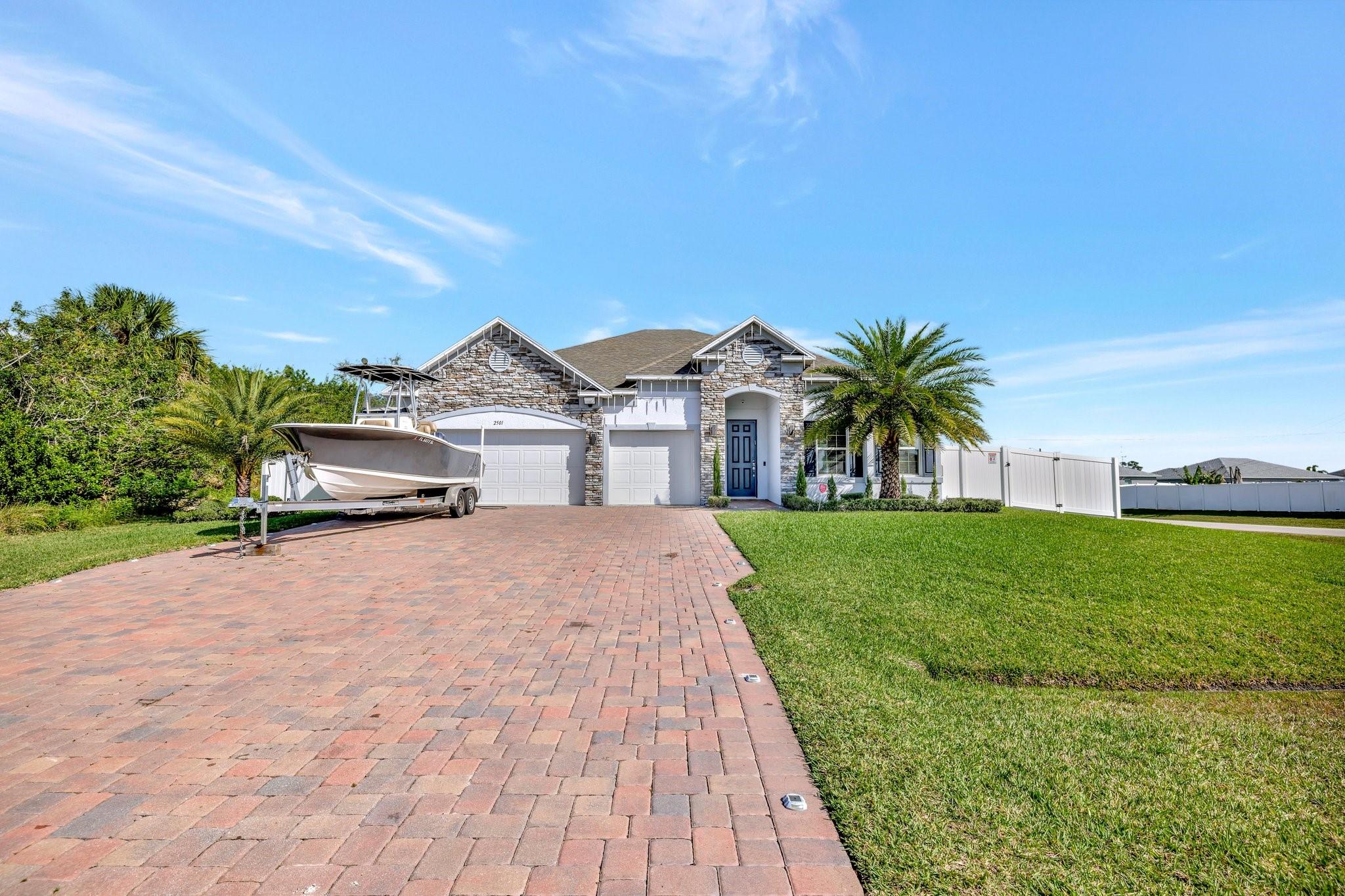 Welcome to PSL the home of your dreams. This is a 4 bedroom, 3 full bathroom, 3 car garage home, heated pool with a sundeck and spa, pool is 14 x 30 and spa is 6x6 and quartz counter tops with a over sized Island. new dish washer, new washer and dryer. This home has a large foyer, 1 master suite room with a private full bathroom, big laundry room. Lots of window for bright lights . Pet friendly neighborhood with a fenced in backyard for privacy. Home is beautiful with farm doors for a cozy cabin home. This home will make you melt come and see for yourself. Close to schools, beaches, restaurants, I95, Florida Turnpike and House of Worship. No LB or Supra, owner occupied please call listing agent, thank you.