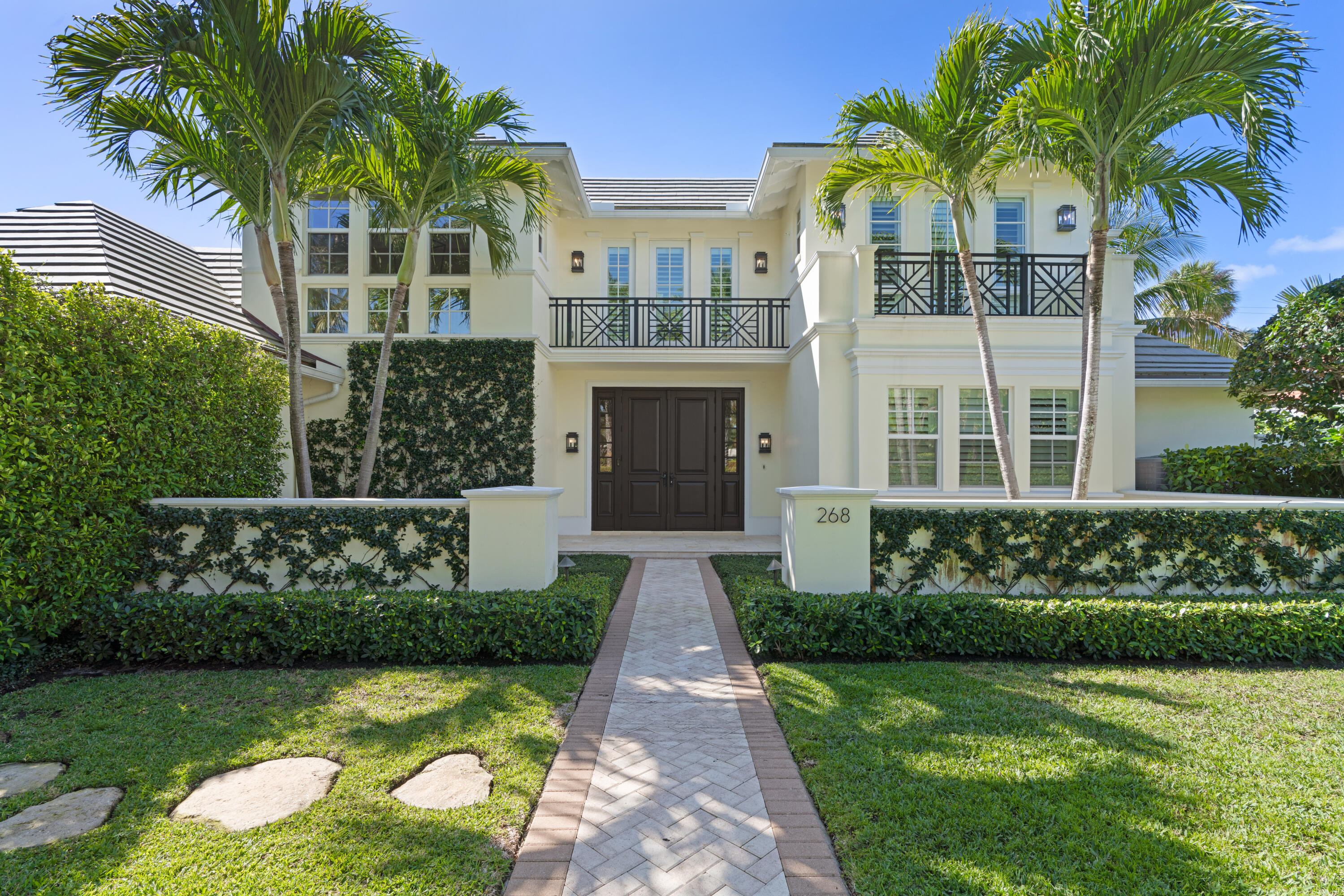 Welcome to 268 Jamaica Lane, a completely turn-key residence offered designer-furnished on the highly desirable North End of Palm Beach. Featuring full interior design by Restoration Hardware and Hive, this exquisite residence boasts 4 beds, an office, an upstairs bonus room, and 5.5 baths spread out over 5,358 total square feet of living space. The home has a gorgeous covered outdoor loggia by the pool that is perfect for entertaining and al fresco dining. Inside the home, you'll find a beautiful downstairs master suite with his and her closets and baths which opens graciously to the heated pool and also connects to a full home office. The downstairs boasts a formal living room, dining room, chef's kitchen, and inviting family room off the kitchen.