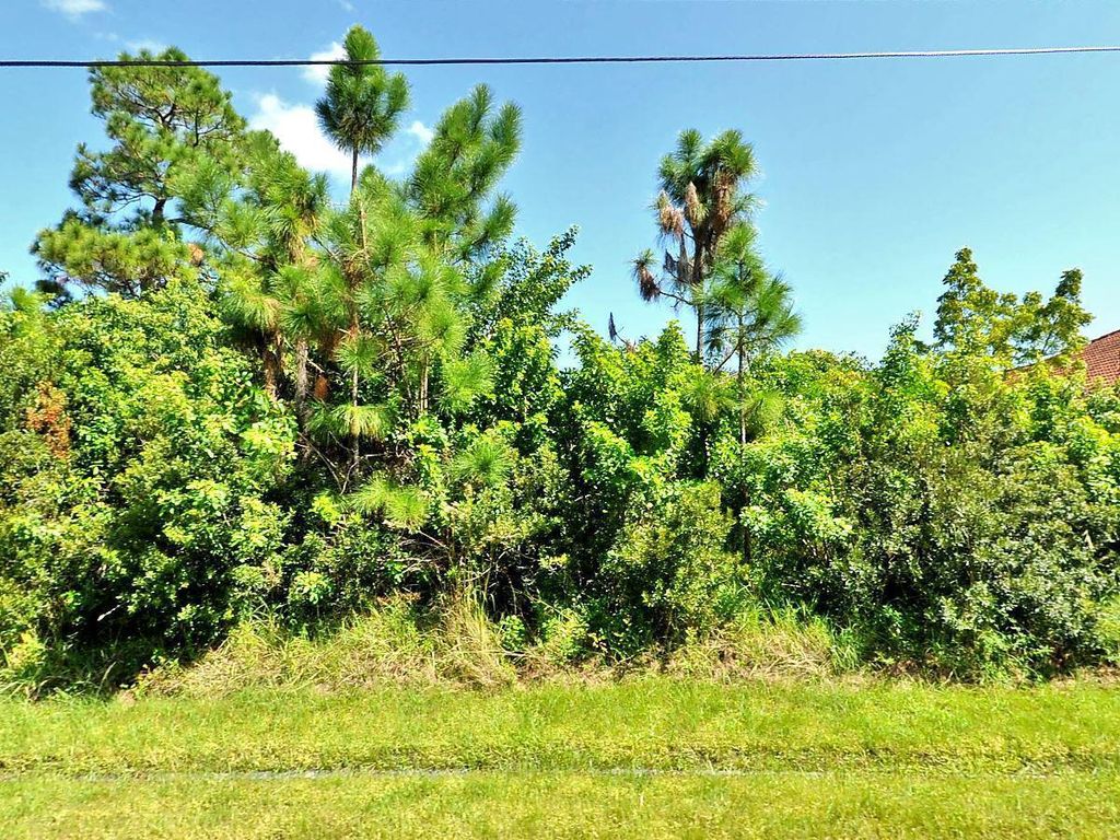 Photo of 5477 NW Arbutus Lane, Port Saint Lucie, FL 34986 (MLS # R10903288)
