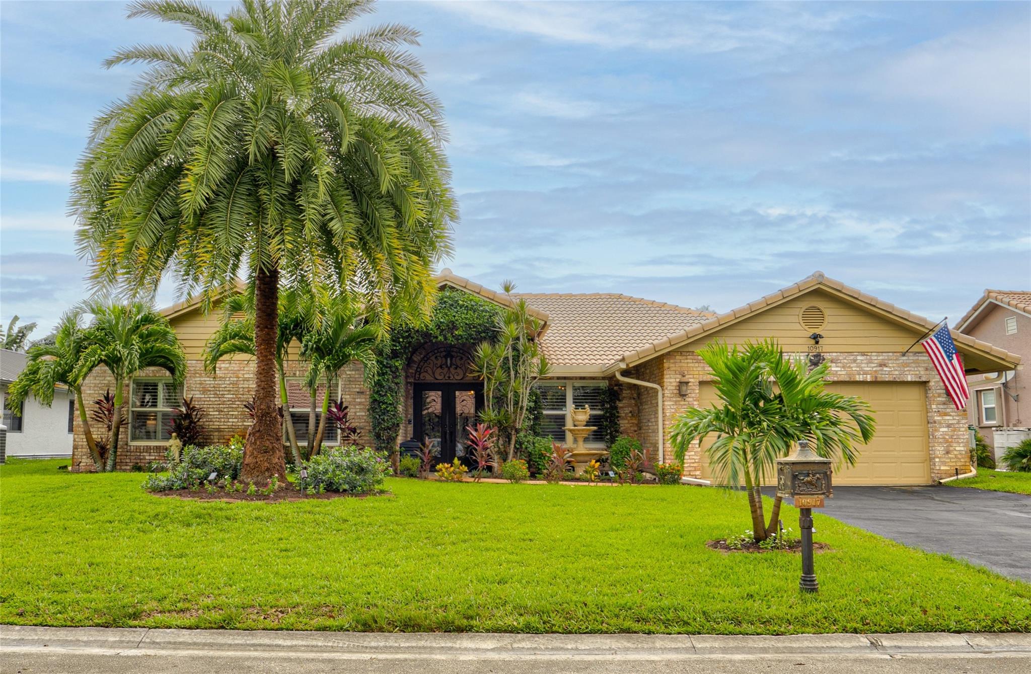 Meticulously maintained Coral Springs home with no HOA, impact windows/doors, plantation shutters, and fireplace. Enjoy a private backyard oasis with heated pool, fenced yard, re-screened lanai, shed with electric, and wiring for outdoor TV. Inside features a custom wet bar with fridge, ironwork accents, central vacuum, and modern security with Ring & ADT cameras. New wiring supports an interior sound system—perfect for comfort, style, and entertaining year-round.