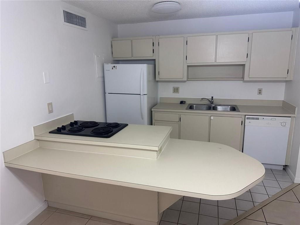 Photo of 645 Executive Center Dr #R104, West Palm Beach, FL 33401 (MLS # F10374052)