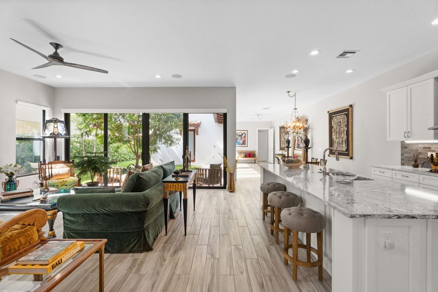 Beautifully upgraded Derby home in the ''Alton'' community located in a prime location on a large green space! This home features: 4 bedrooms, a den/office,  3 full baths PLUS 2 half bathrooms, including a large, attached BONUS room that serves as a spacious 4th bedroom or flexible living space. The bright white kitchen offers modern SS appliances, quartz countertops,a large stainless sink, walk-in pantry, and opens to the main living area & extended Florida room overlooking the lush, landscaped yard. Wood plank tile & LVP flooring add a modern touch throughout the home. Upstairs includes 3 bedrooms highlighted by a large primary suite with an oversized walk-in closet and custom built-ins. The affluent community of Alton maintains miles of walking trails, clubhouse with oversized pool, sports courts, Tot Lot playgrounds and dog parks. The Alton town center is a top local destination with shopping, dining and all the essentials within walking distance or take your golf cart. I-95, the Turnpike, The Gardens Mall and local beaches are in close proximity. PBI Airport is within 20 minutes.