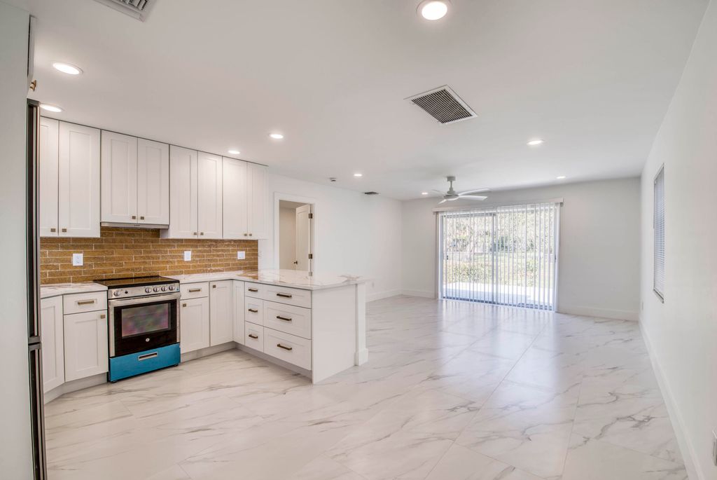 Photo of 10084 Meridian Way N #4, Palm Beach Gardens, FL 33410 (MLS # R11158598)