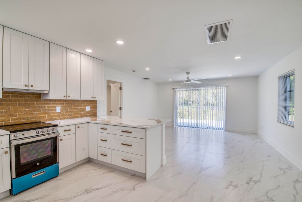 Photo of 10084 Meridian Way N #4, Palm Beach Gardens, FL 33410 (MLS # R11158598)