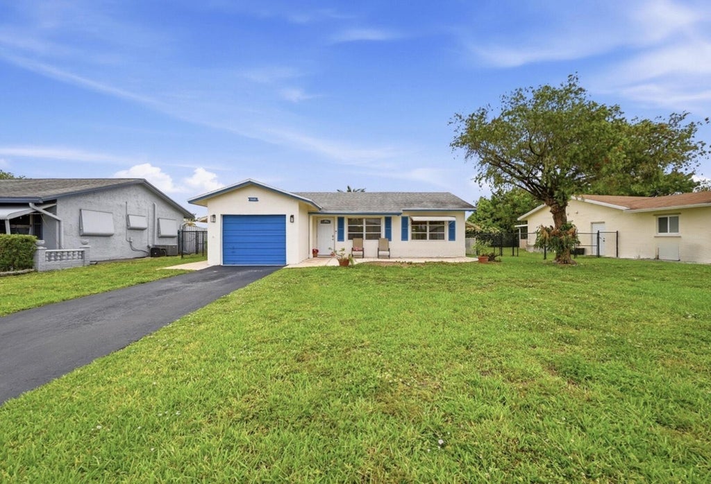Photo of 9505 NW 73RD ST, Tamarac, FL 33321 (MLS # B26080967)