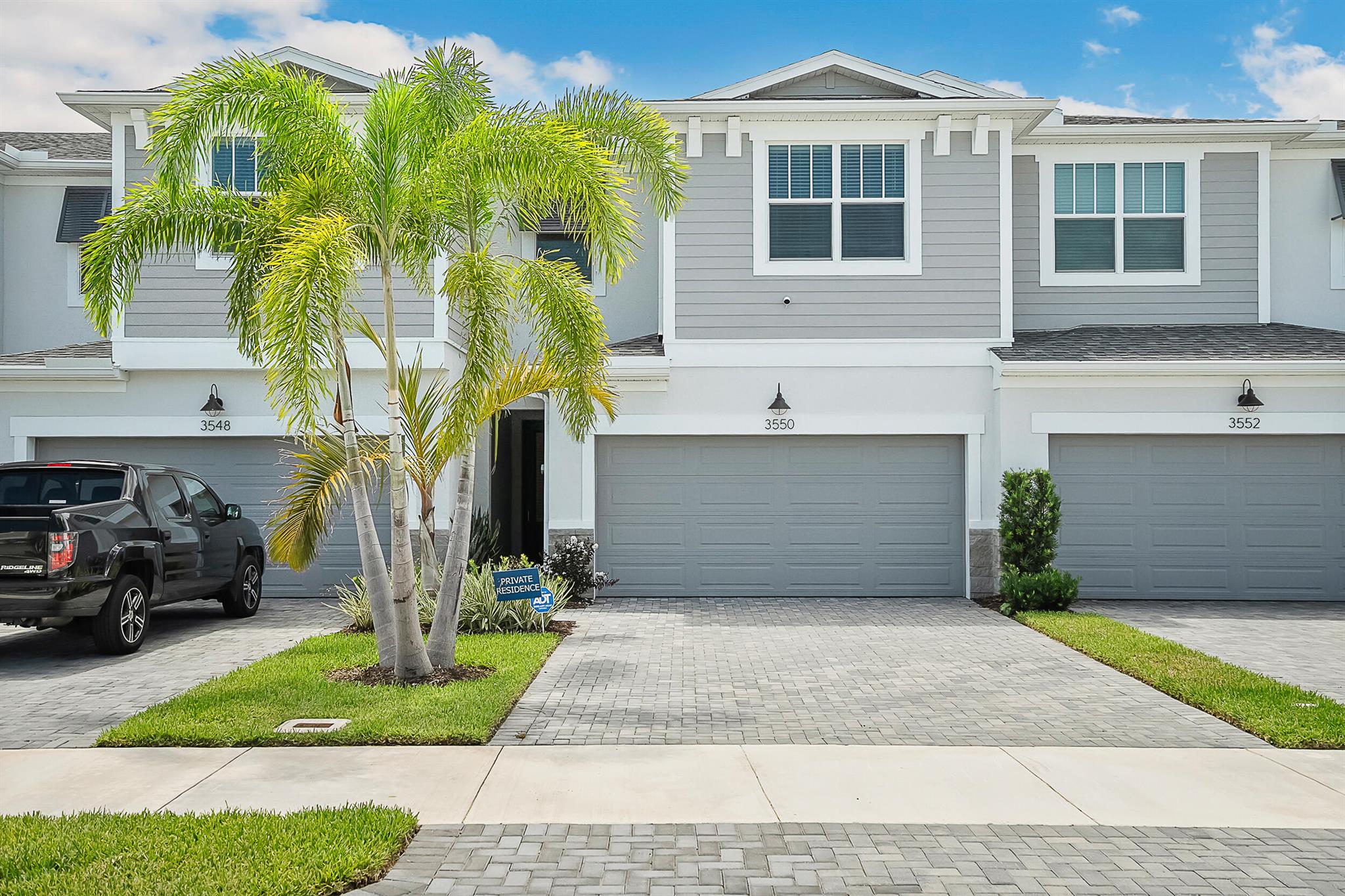 Brand new Dylan floor plan townhome in the heart of Jensen Beach! This 3 bedroom, 2.5 bath, 2-car garage home showcases luxury designer finishes throughout. Enjoy peace of mind with full impact windows, a stylish glass entry door, and elegant stone exterior accents. The gourmet kitchen features 42'' cabinets, quartz countertops, and stainless-steel appliances, while the spacious living area flows seamlessly with luxury tile flooring. Upstairs you'll find a loft and a primary suite with his & her quartz vanities, plus a quartz double vanity in the guest bath. Additional highlights include two-panel interior doors, ceiling fans, and a paver driveway and porch. Relax on your back porch overlooking the serene lake. Ideally located just 10 minutes from Hutchinson Island Beaches.