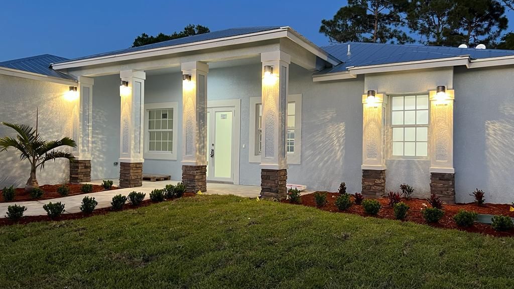 Photo of 1829 SW Certosa Road, Port Saint Lucie, FL 34953 (MLS # R10791444)