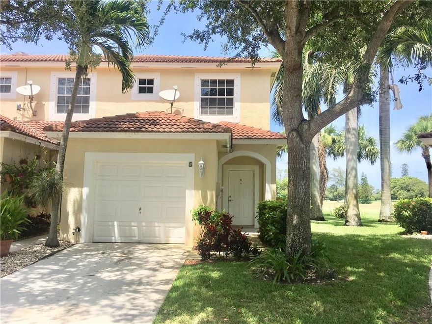 Take advantage of this wonderful townhouse with garage is located near plenty of shopping, dinning and recreational places to go to! This beauty features lots of natural lighting throughout,  BRAND NEW untouched kitchen appliances, new wood floors upstairs and tile on 1st floor, washer and dryer on 2nd floor, spectacular golf course, lake and canal view. The neighborhood is quiet and tranquil. There is plenty of storage space and ample living area. There aren't many of these available!