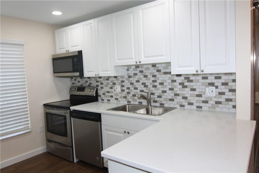 Beautifully updated 2 bedroom 2 bathroom in a gated section of Manors of Inverrary. Freshly painted, updated open-concept kitchen, updated bathrooms, wood look ceramic tile throughout, decora switches and outlets throughout, updated lighting and fans. Storage closet included. Association includes water, sewer, basic cable, and internet. All Ages Community. Come and see this move-in ready condo soon, it will not last.