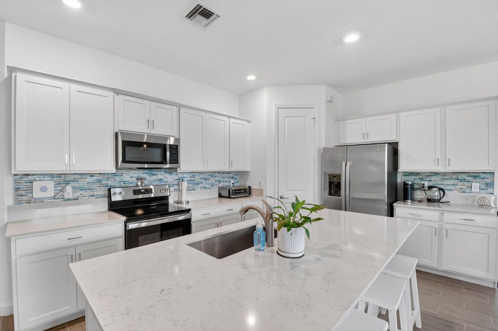 Photo of 6026 Henderson Way, West Palm Beach, FL 33415 (MLS # B26033194)