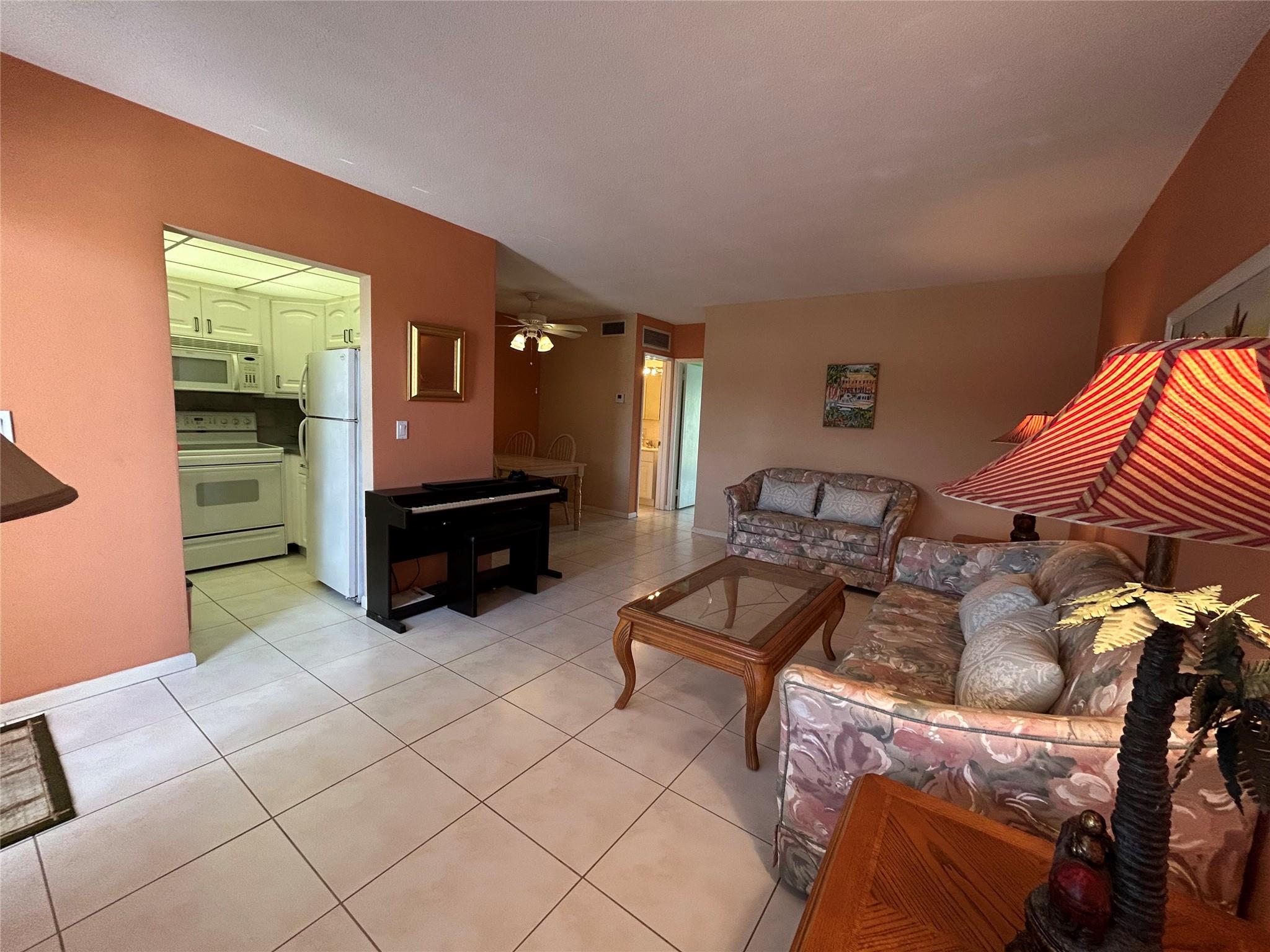 Fabulous Lighthouse Point 2nd floor condo with lovely views of Heated pool, Club house and putting green. Super nice, and clean with neutral tile throughout, Stylish white shutters on windows. Updated white kitchen, master bath has updates as well. This is a 55 + very active community. There is a rec/land lease included in the monthly maintenance. Sorry no pets, association requires 25% down for mortgage. No lease first two years then you may rent 2 times a year for a minimum of 30 days.