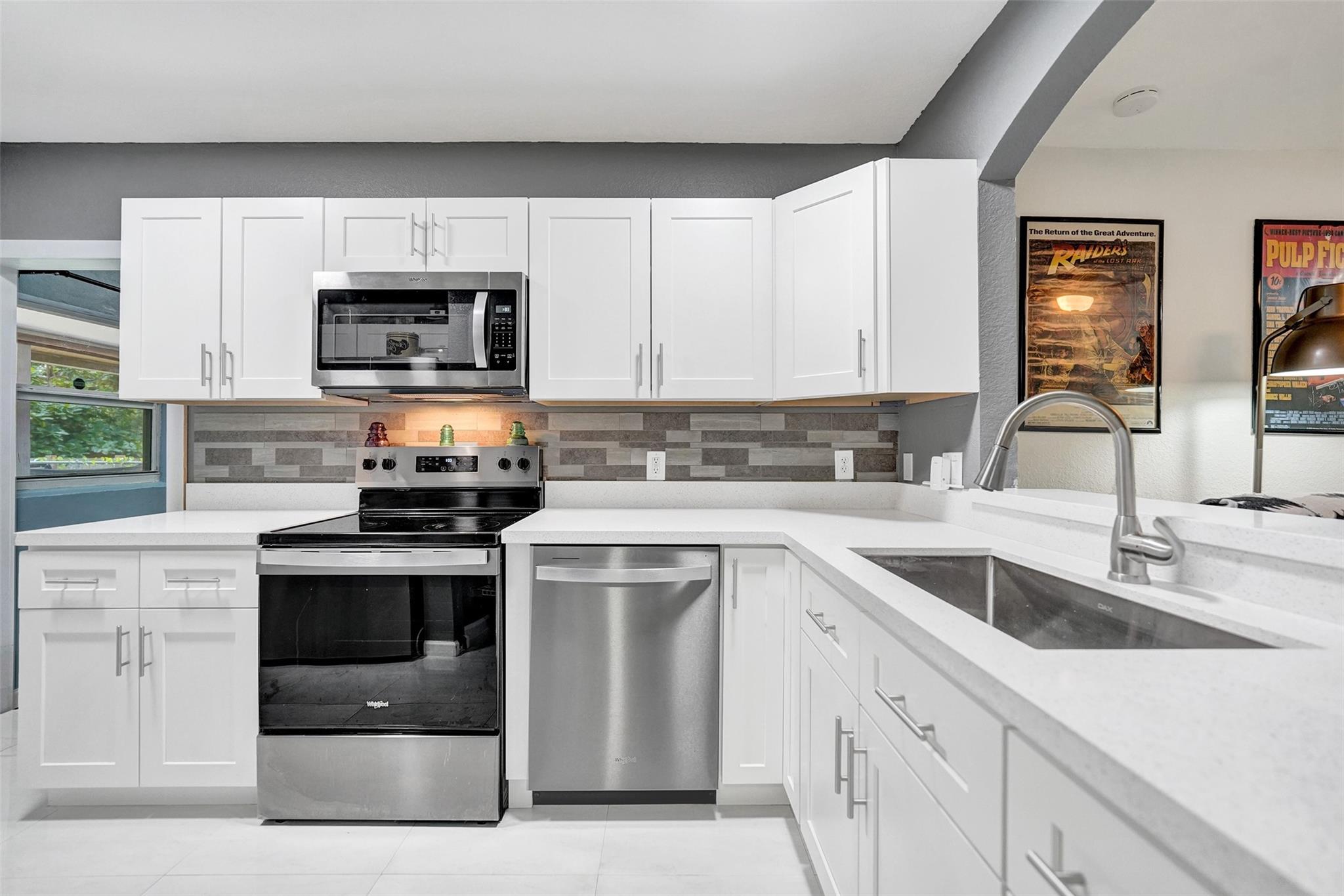 Amazing location! Just 10 minutes from Fort Lauderdale Airport, 10 minutes from Las Olas Beach, and 2 minutes from I-95 & I-595. Beautifully remodeled home. Features a completely separate studio apartment, fully equipped and recently updated. Perfect for in-laws, guests, or as an income-producing opportunity. New kitchen with cabinets, counters & appliances (2025), 24” marble tile floors (2022), renovated baths (2025), new doors, baseboards, fans & closets (2025). Studio updated 2024, laundry w/ washer & dryer (2022). Freshly painted exterior (2023), vinyl fence (2022), enclosed porch (2024), shed (2024). Roof 2008–09, A/C 2014,water heater 2016. Backyard with mango, avocado & more. Move-in ready!