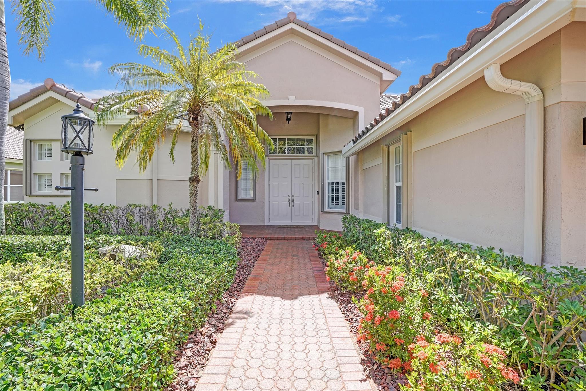 Welcome to your tropical lakefront paradise in Parkland Isles Bayside Estates! This stunning 5-bedroom,3 bath triple split pool home features a brand-new 2025 tile roof, renovated kitchen and baths, a saltwater freeform pool, and a spacious screened patio perfect for entertaining. Enjoy a 3-car epoxy-floor garage with pull-down attic stairs, lush landscaping, crown molding throughout, accordion shutters, and newer dual-zone A/C units(both under 5 years old).Modern upgrades include USB outlets in every bedroom,2023 Nest smart thermostats, smart irrigation, reverse osmosis, and whole-house carbon water filtration covers ADT security, high-speed internet, and cable. Located just a short walk to A-rated schools Park Trails, West Glades, and Stoneman Douglas this is South Florida living at