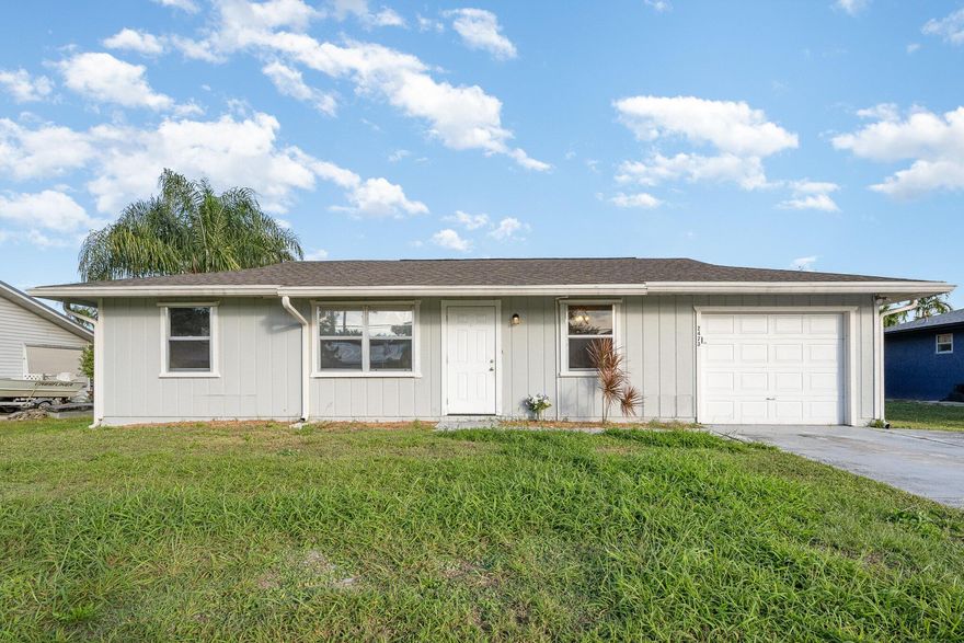Welcome to 2473 SW Warwick St, Port St. Lucie, FL 34983! This home features a spacious backyard with a chain-link fence, ideal for outdoor activities. Inside, enjoy tile flooring throughout, a modern kitchen with granite countertops, and stainless steel appliances.Located near the Town Center at St. Lucie West, you'll have convenient access to shopping, dining, and entertainment options. For beach enthusiasts, the beautiful shores of Bathtub Beach on Hutchinson Island are approximately a 25-minute drive away, offering pristine waters and a perfect spot for relaxation. Don't miss the opportunity to make this well-appointed property your new home!
