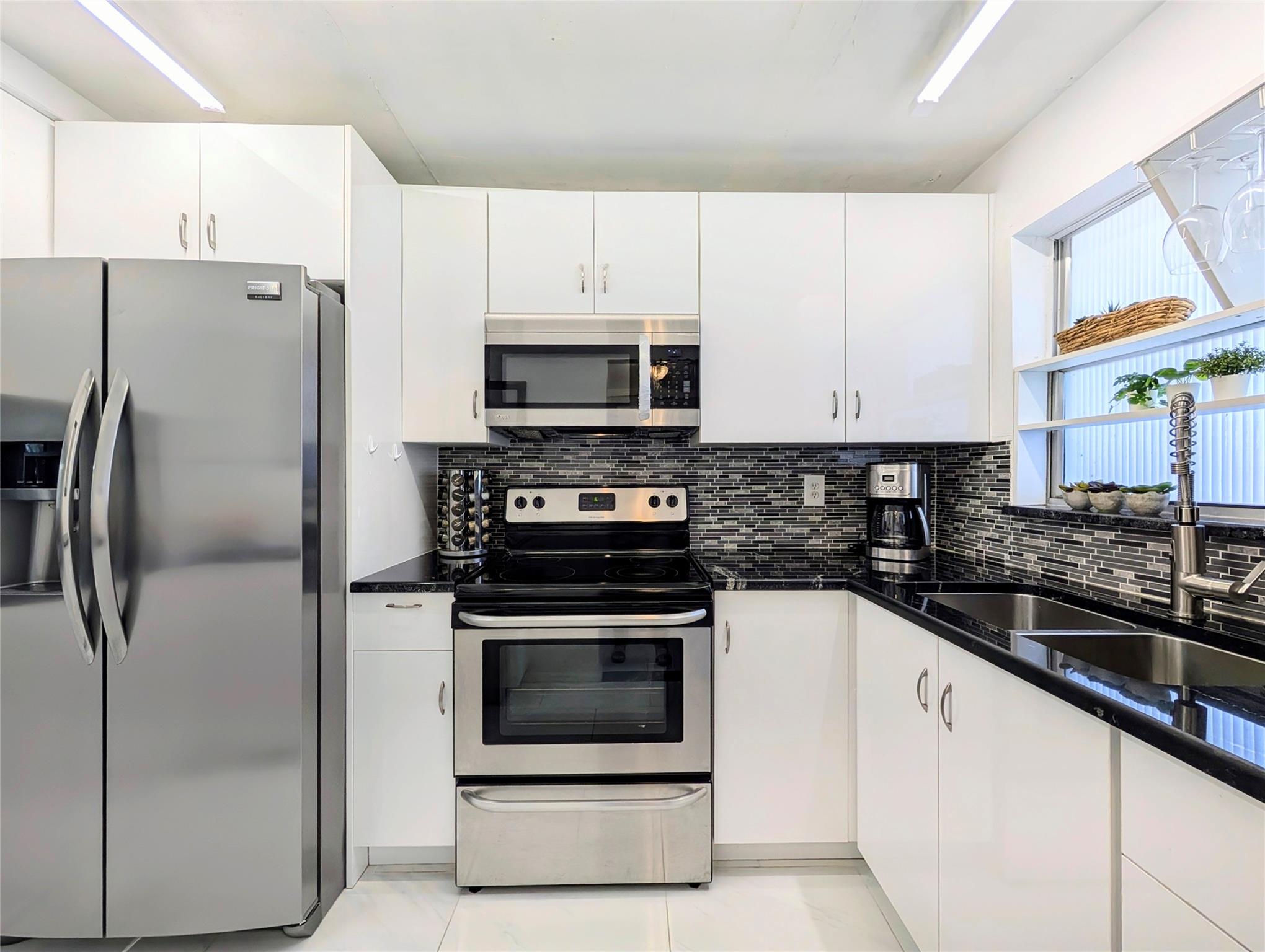 PRICED TO SELL! Come to see this BEAUTIFULLY UPDATED UNIT, and be ready to call it home! Enjoy being part of Sunrise Lakes, a 55+ community and everything it has to offer: Theater, fitness center, billiard room, shuffle boards, tennis courts, shuttle bus, golfing nearby, and so much more. Close to shopping, restaurants, Banks, the Sawgrass Mills Mall, and just minutes to the beach. Not in the mood to go out? Stay home and enjoy the view to the canal from your enclosed balcony. RENOVATIONS WERE MADE FOR YOU: Porcelain floors througout, moderns kitchen and bathroom cabinetry, stone counter tops, barn glass doors in bathrooms, LED lightfixtures... Check the photos and fall in love!