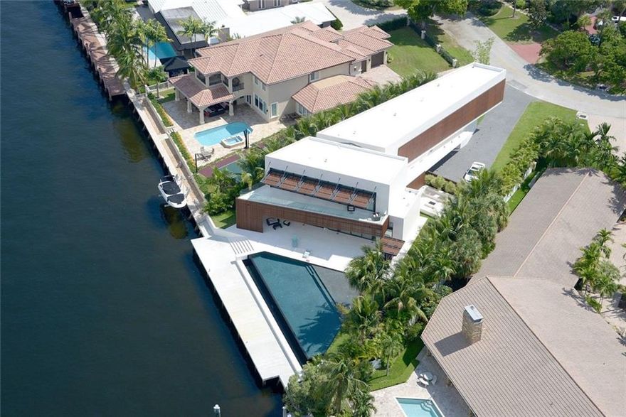 Stunning modern architectural designed property located in beautiful Sea Ranch Lakes. This property has won multiple architectural awards and featured on the cover of Tropic magazine. Enjoy boating from your private dock or the beach from private clubhouse.