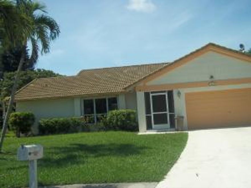 Gorgeous one story home in the middle of the cul-de-sac on the lake. This is the best lot in the development. This home has been completely redone and a bedroom has been added, great for an office or nursery. Brand new eat in  kitchen with beautiful honey colored cabinets, granite and stainless steel appliances. Both bathrooms have been magnificently upgraded as well. The pool is oversized with a huge screened in patio all overlooking the lake.