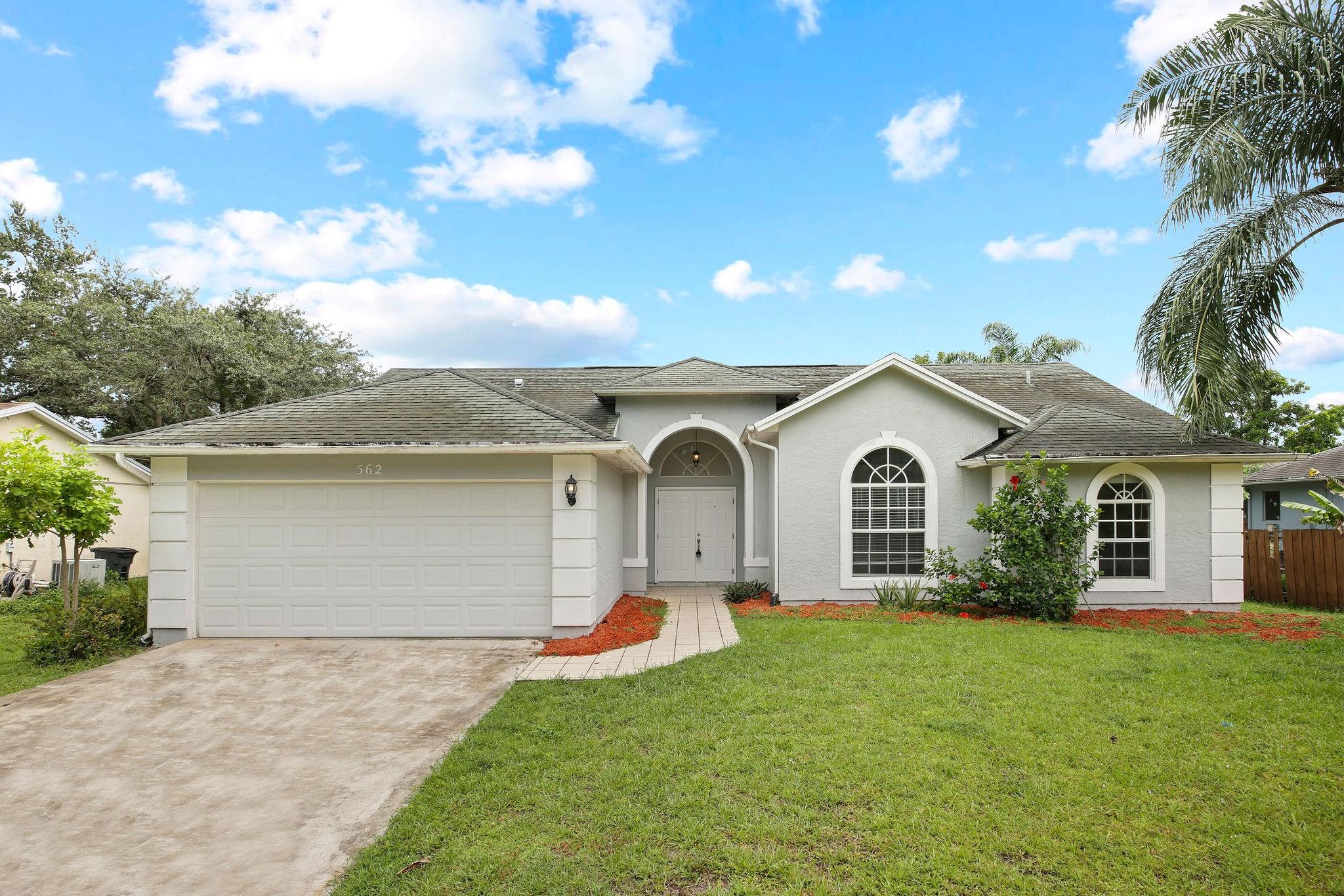 Welcome to this beautifully maintained one-story home offering 3 spacious bedrooms and 2 full bathrooms, complemented by a large 2-car garage. The open floor plan creates a welcoming atmosphere, seamlessly connecting the living, dining, and kitchen areas—perfect for both everyday living and entertaining guests. The kitchen features a convenient bar, stainless steel appliances, and a bright breakfast area with a charming bay window that looks out onto the backyard, flooding the space with natural light. The living room is enhanced with built-in shelves, providing ample space for your favorite books and decor. The primary bathroom boasts a double vanity, along with a separate tub and shower, offering a spa-like retreat. Schedule a showing today!